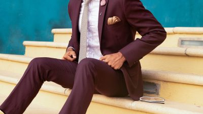 Person sitting on stairs beside sunglasses